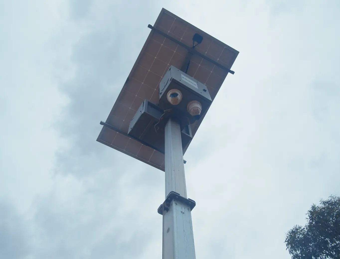 Solar-powered Piksort site camera installed on a mast at a construction site