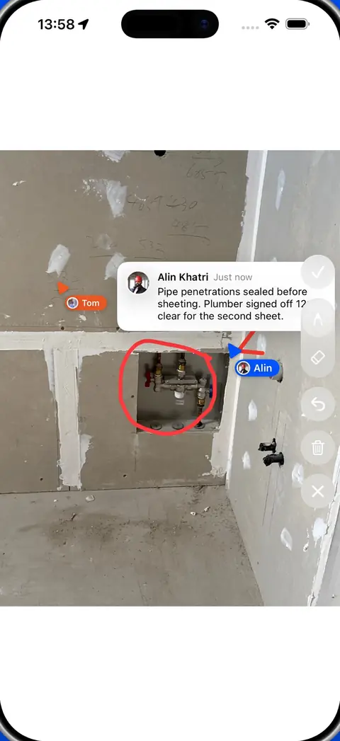 Markup on a site photo in the Piksort app: a red circle around a pipe penetration and a comment from the plumber